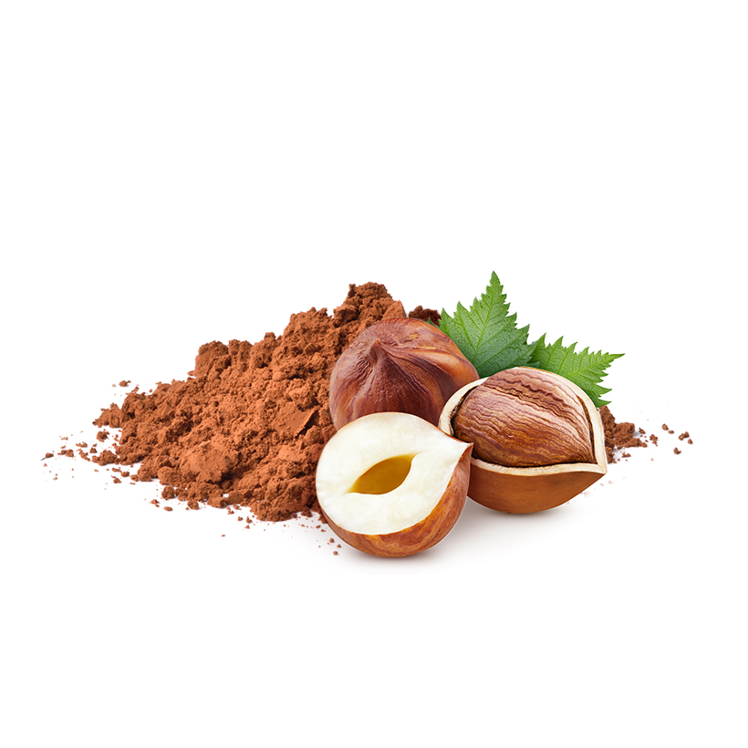 Photo culinaire composition Gavottes Cœur cacao noisette Locmaria, tas de poudre de cacao, noisette et feuilles vertes à l’arrière plan